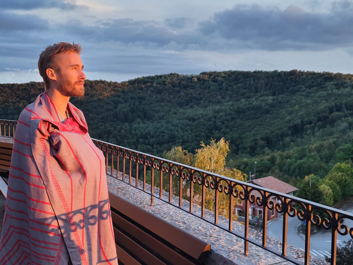 Chris on a balcony at sunset